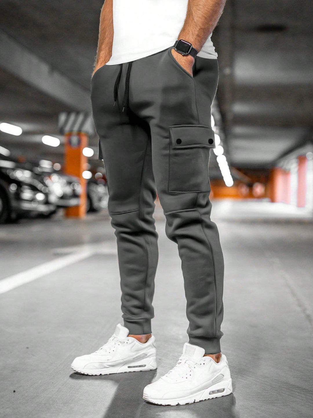 Men's slim-fit joggers in streetwear style, shown in a relaxed, comfortable pose.