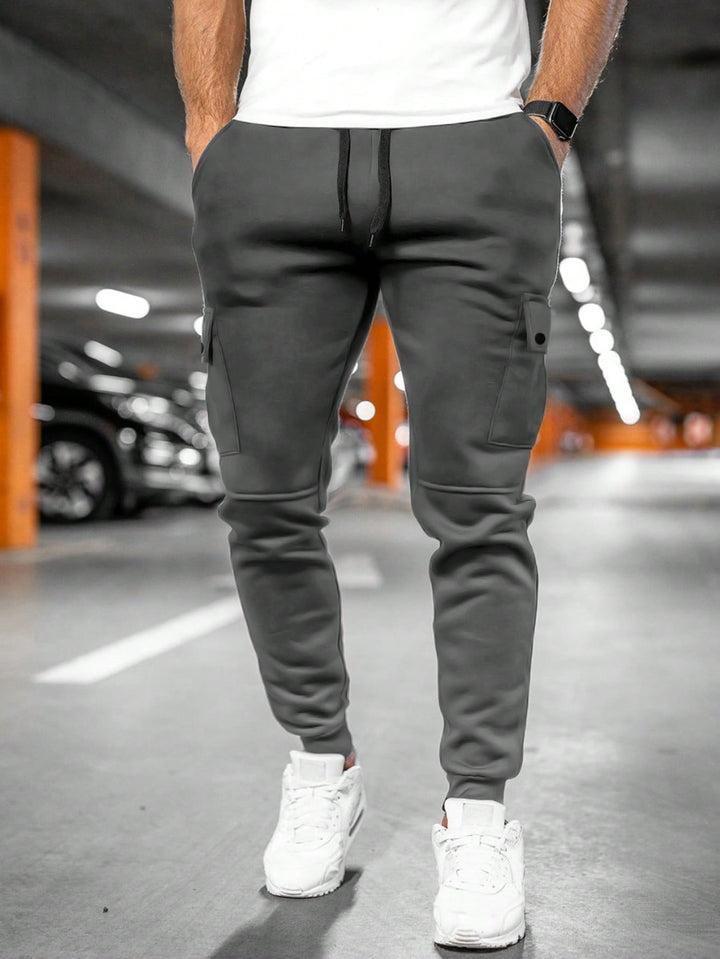 Men's slim-fit joggers featuring a comfortable drawstring waist and tapered design.