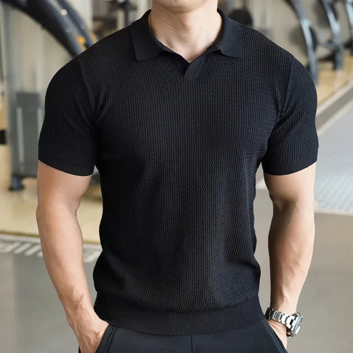 Comfortable men's collared polo shirt with a stylish textured finish. A versatile slim fit top for casual fashion.