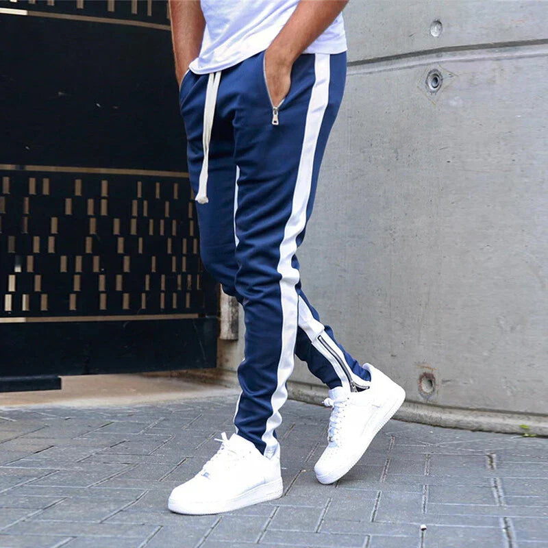 Sporty men's slim fit casual sweatpants with convenient zip hems for modern street style.