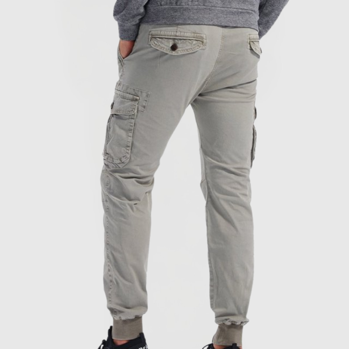 Fashionable men's slim fit cargo jogger pants, ideal for modern streetwear, featuring tapered leg & multiple utility pockets.