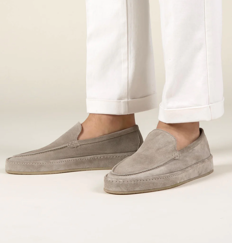 Side view: Men's elegant slip-on loafers, showcasing cushioned design for comfort.