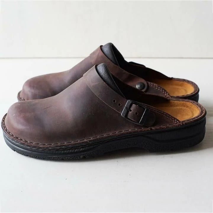 Modern men's fashion mules featuring secure heel strap for easy slip-on, versatile everyday comfort.
