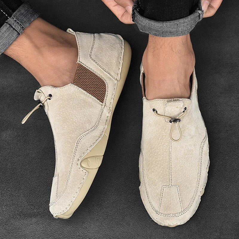 Men's slip-on shoes with adjustable lock closure for a comfortable, secure fit. Ideal lightweight casual loafers.