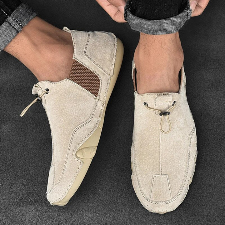 Men's slip-on shoes with adjustable lock closure for a comfortable, secure fit. Ideal lightweight casual loafers.