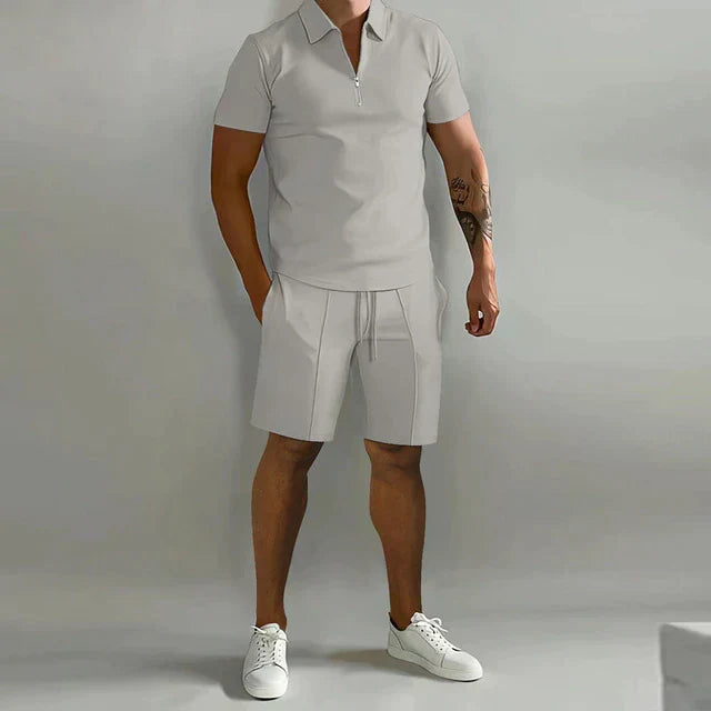 Men's neat summer two-piece: a smart casual zippered polo and matching drawstring shorts for warm weather style.