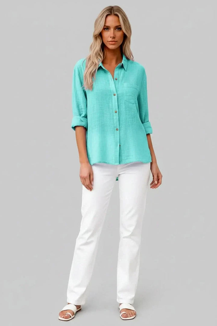 Solid color men's short sleeve button-up, lightweight & versatile for summer fashion.