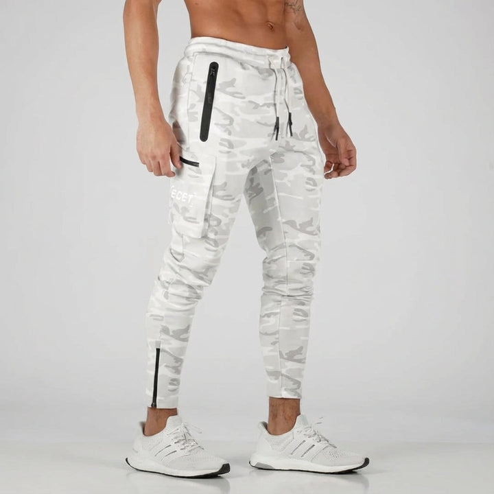 Tapered fit men's activewear joggers, ideal for gym & streetwear, featuring practical secure zipper pockets.