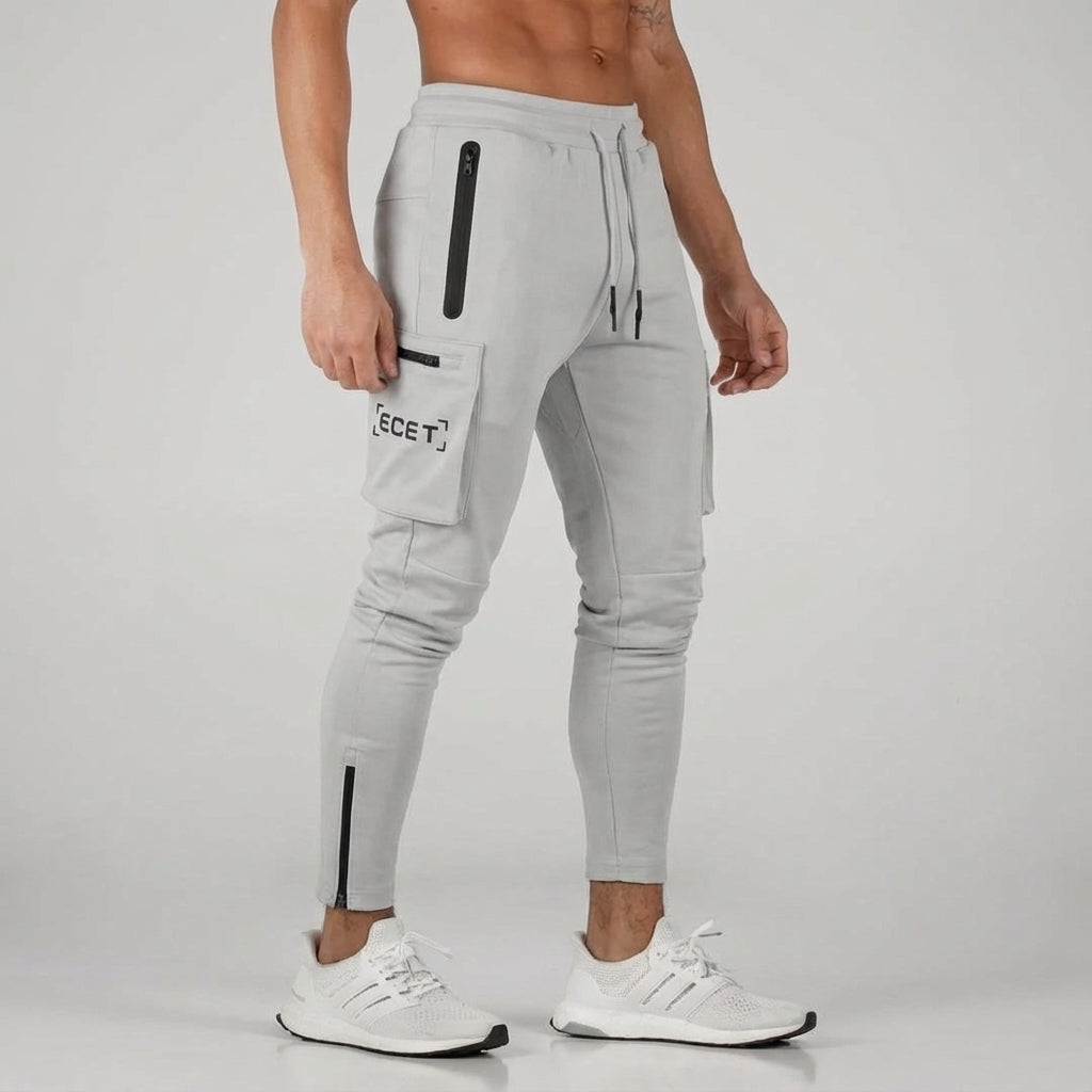 Durable men's comfort pants; activewear joggers with secure zipper pockets, designed for everyday and workout sessions.