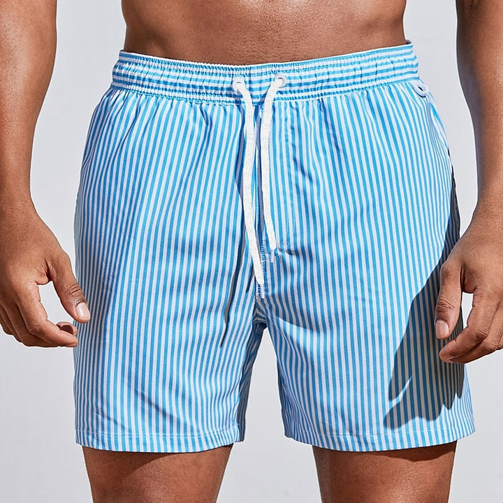 Comfy men's striped swimwear shorts with drawstring, ideal for casual beachwear and summer pool days.