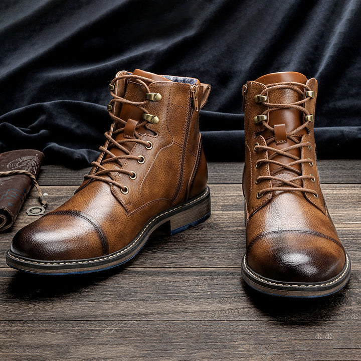 Premium leather mens ankle boots with a sophisticated cap toe and secure lace-up closure.