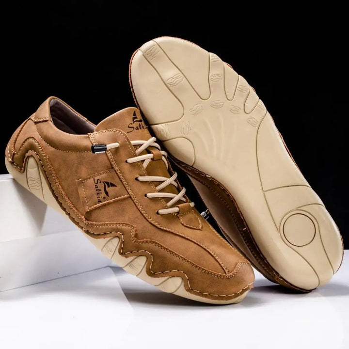 Durable men's low top lace-up sneakers with a comfortable round toe.