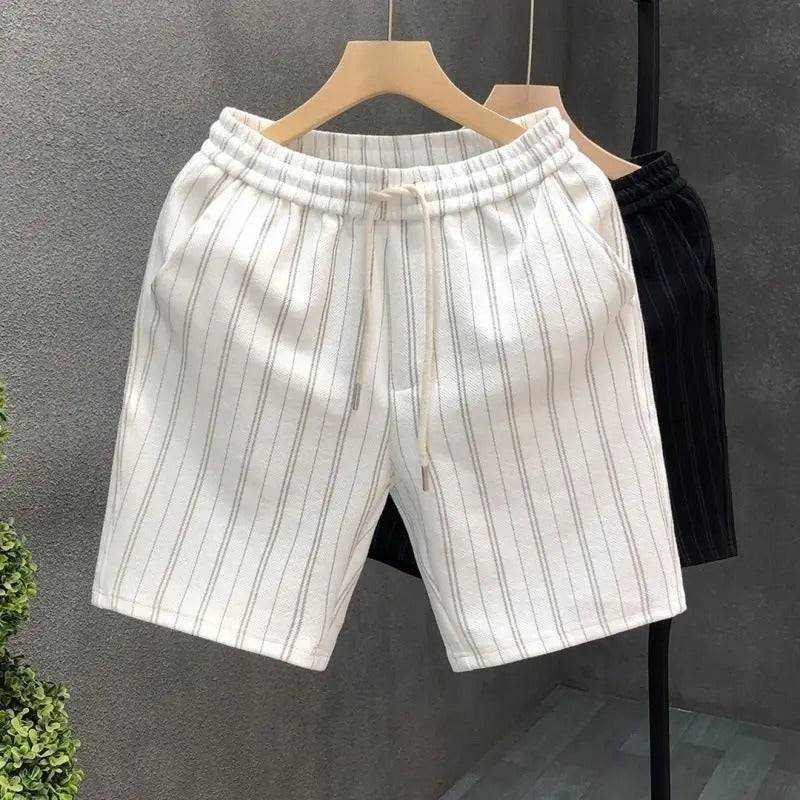 Comfortable men's pinstripe shorts. Tailored casual bottoms with a relaxed fit for warm weather style.