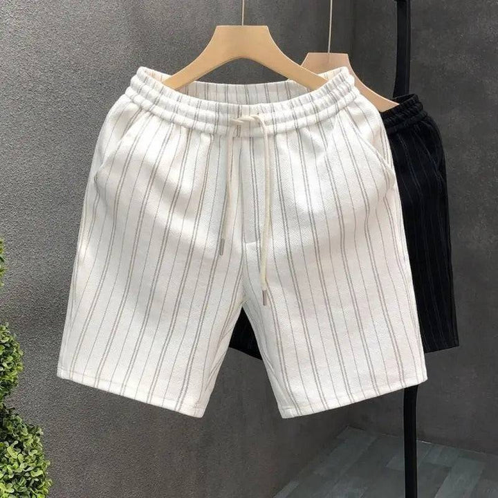 Comfortable men's pinstripe shorts. Tailored casual bottoms with a relaxed fit for warm weather style.