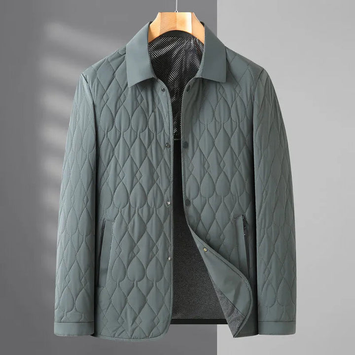 Warm men's collared quilted jacket with button-down closure, suitable for stylish winter outfits.