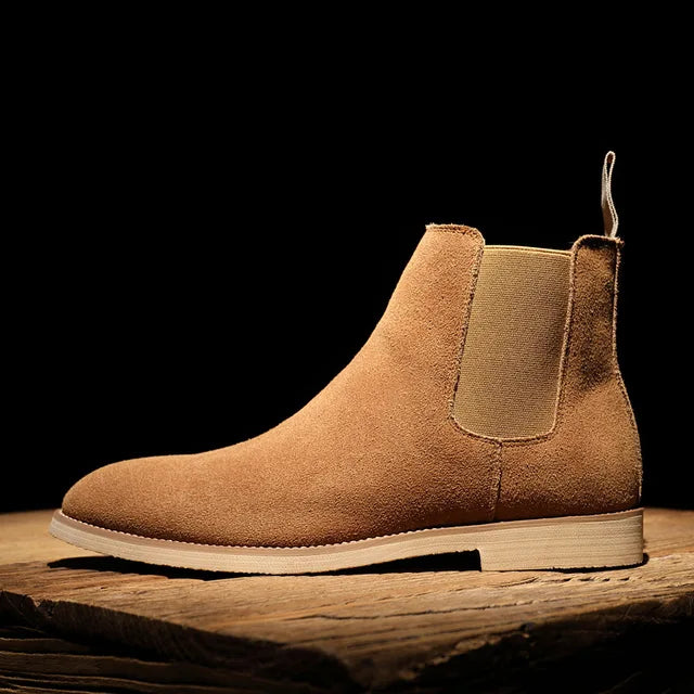 Classic brown leather men's Chelsea boots, slip-on design for easy wear and timeless style.