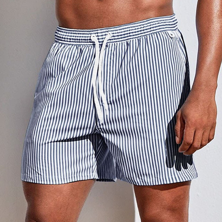 Close-up of men's striped swim trunks, highlighting drawstring detail, quick-dry fabric, and stylish pattern.