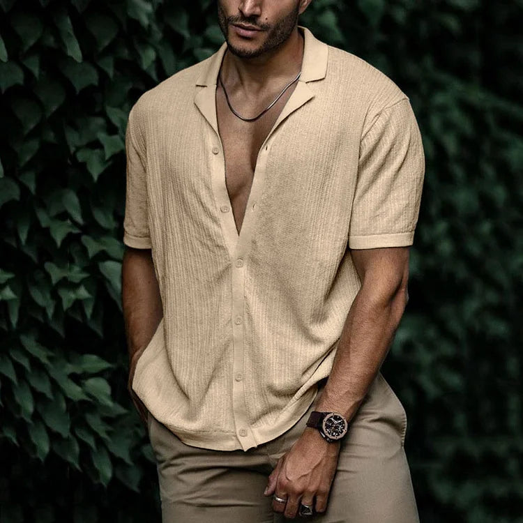 Close-up of men's textured short sleeve Cuban collar shirt, showing unique fabric & relaxed fit.