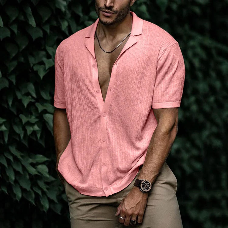 Man enjoying beach day in a relaxed fit textured Cuban collar summer shirt. Ideal warm weather style.
