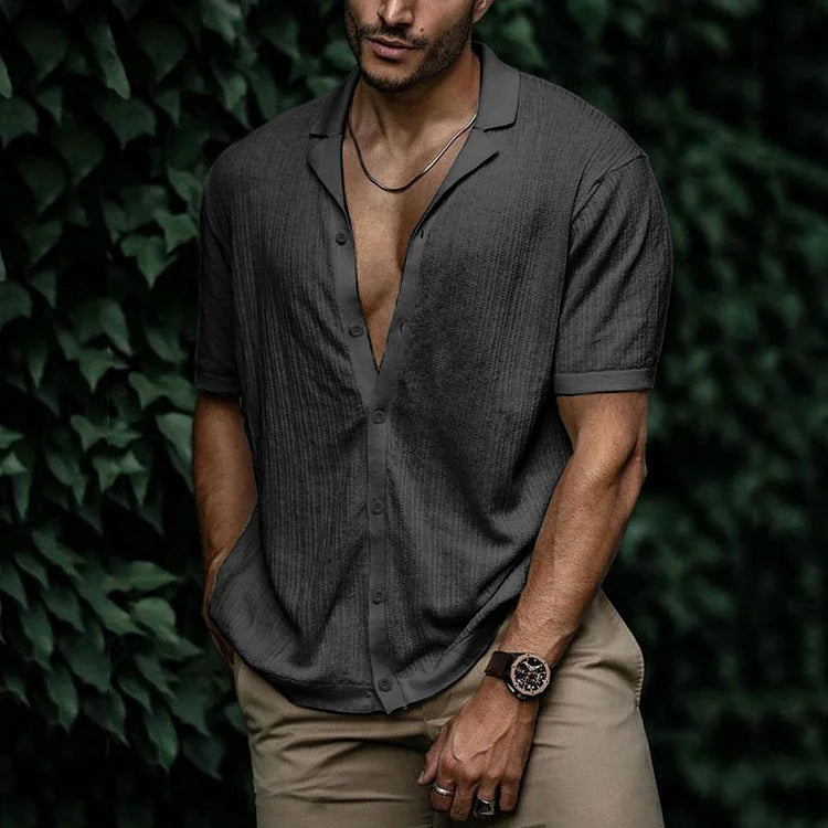 Men's stylish textured short sleeve Cuban collar summer shirt on a hanger. Ready for warm weather.