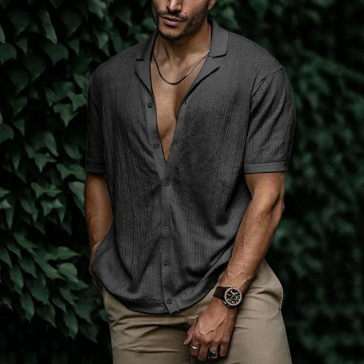 Men's stylish textured short sleeve Cuban collar summer shirt on a hanger. Ready for warm weather.