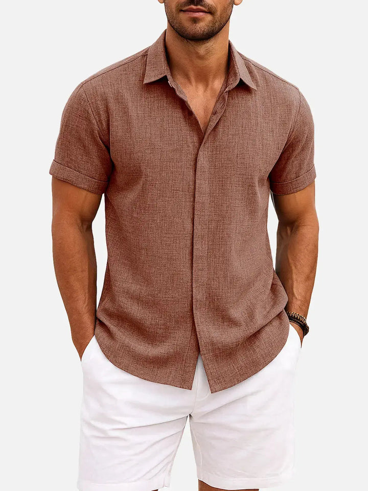 Casual men's collared shirt, short sleeve, textured fabric, button down for effortless style.