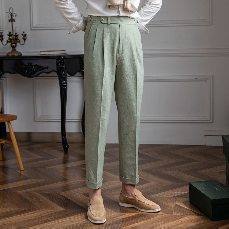 Black high-waist pleated men's trousers with a tailored, straight leg fit. Essential smart-casual office wear.