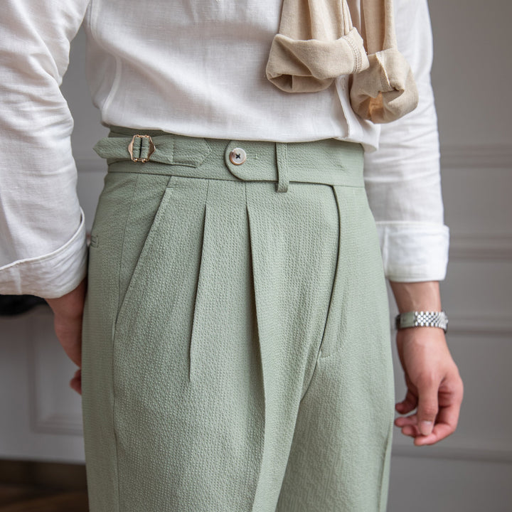 Full-length view: Men's tailored high-waist pleated trousers. Straight leg fit, perfect for smart office fashion.