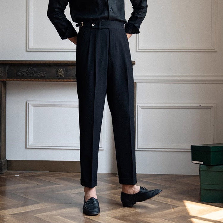 Modern blue men's high-waist pleated trousers. Tailored straight leg design for a sharp, smart-casual look.