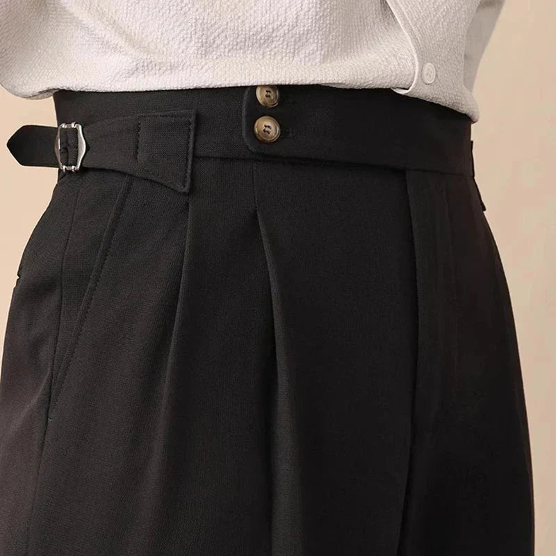 Men's high-waisted pleated trousers with tailored fit & elegant side buckle. Perfect for a chic business look.