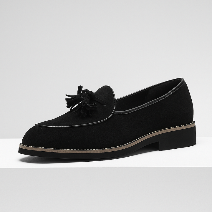 Stylish men's black suede tassel loafers, a versatile choice for dress shoes or smart casual outfits.