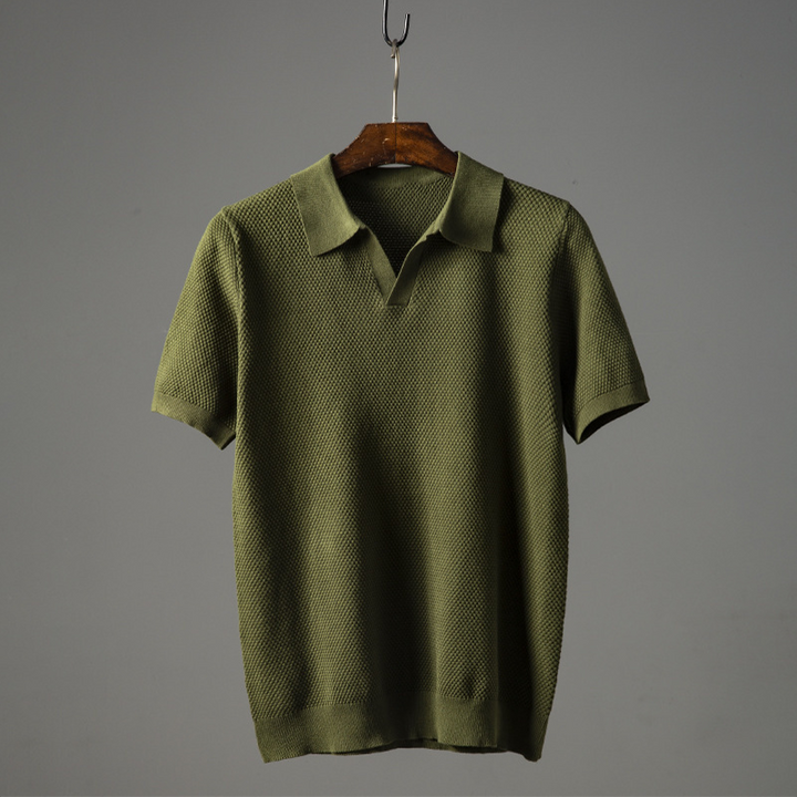 Men's textured short sleeve polo shirt with a stylish geometric pattern for casual wear.