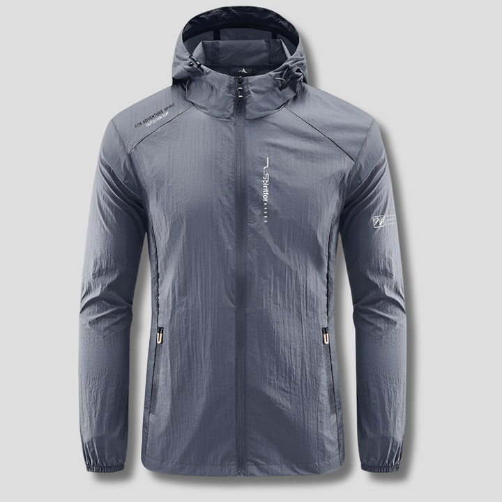 Active man wearing a lightweight hooded jacket, perfect for sun & wind protection during outdoor activities.
