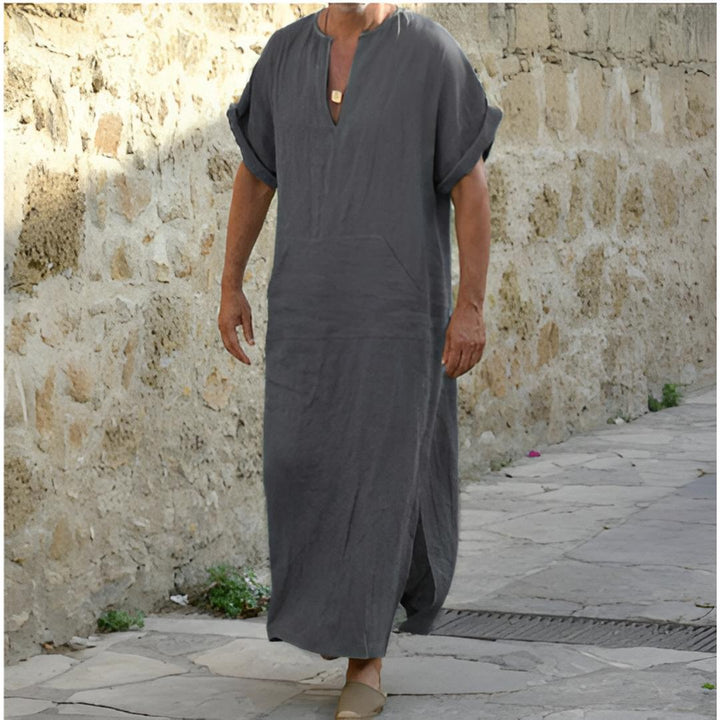 Comfortable men's V-neck long shirt with side slits & utility pocket. Versatile, relaxed fit for casual style.