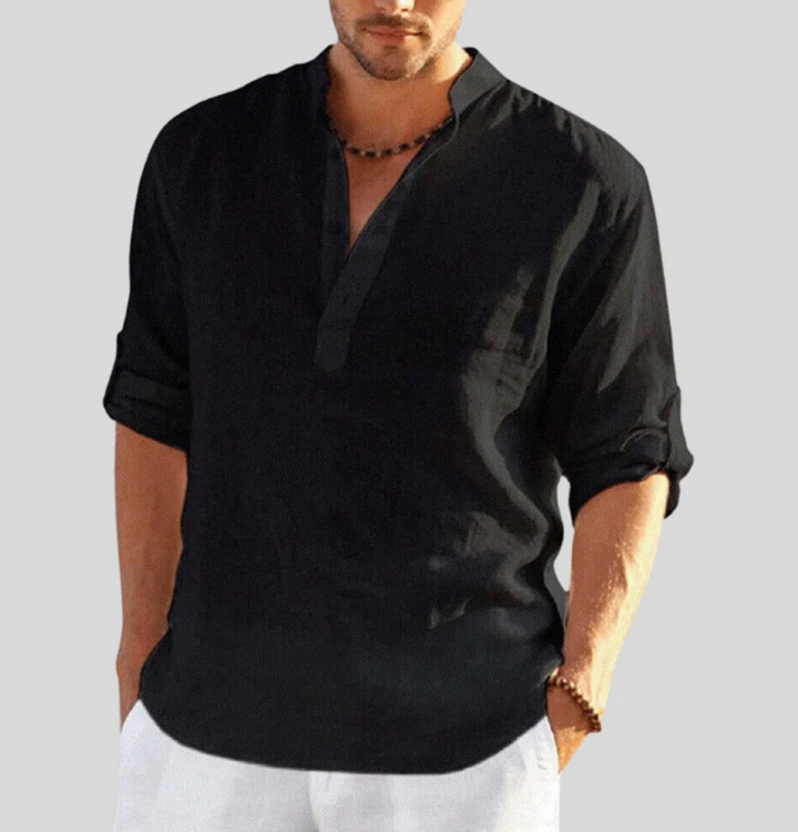 Model wearing a comfortable men's V-neck short sleeve button-up shirt for relaxed summer style.