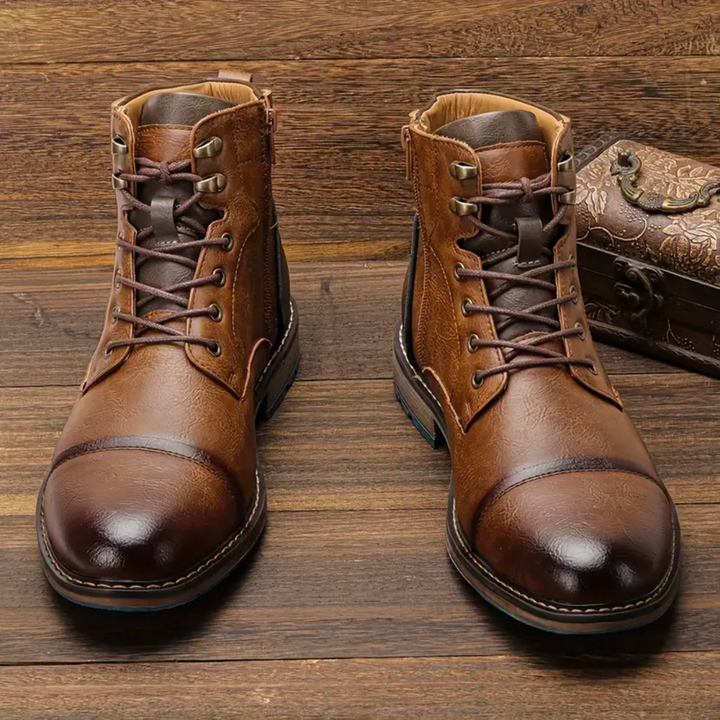 Close-up of men's vintage brown leather boots with detailed lacing