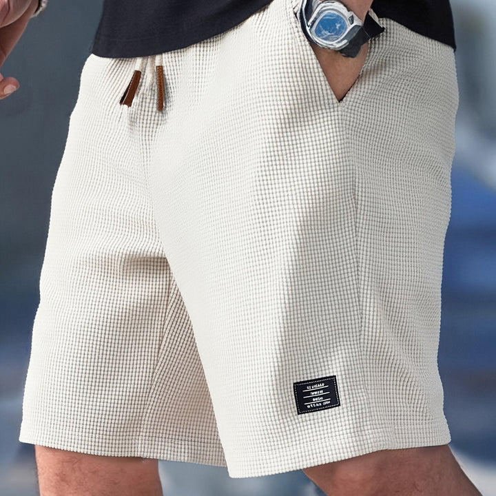 Soft grey men's waffle knit relaxed fit shorts, perfect for lounging, travel, or everyday comfort.