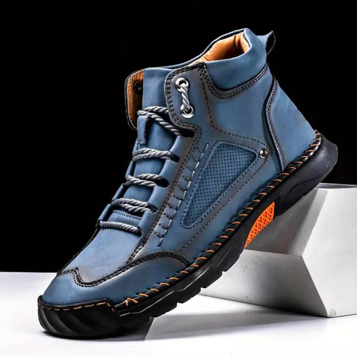 Men's waterproof trekking boots, engineered with strong arch support for stability.