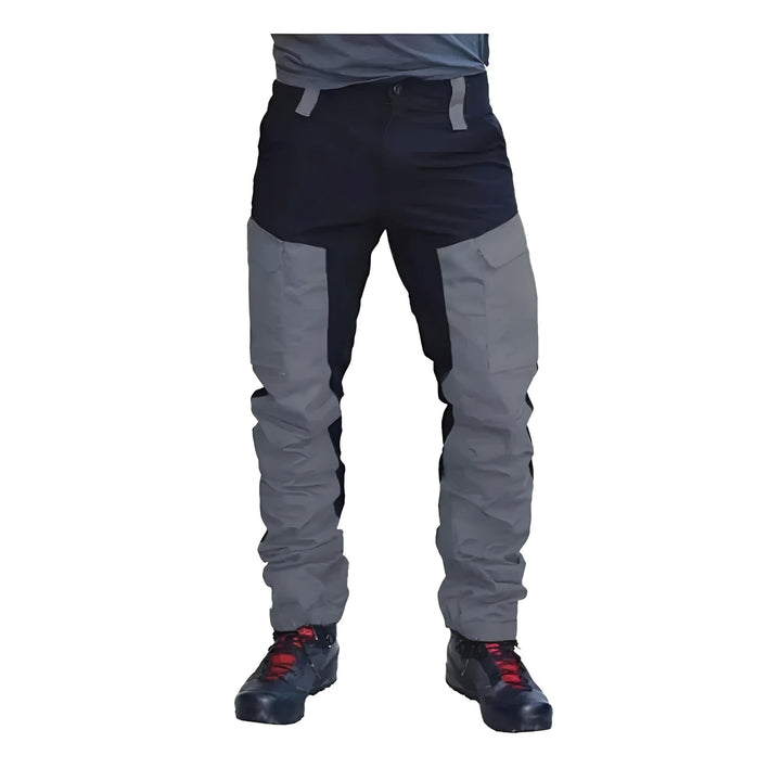 Men's weatherproof cargo work pants for outdoor use, featuring reinforced stitching and multiple utility pockets.