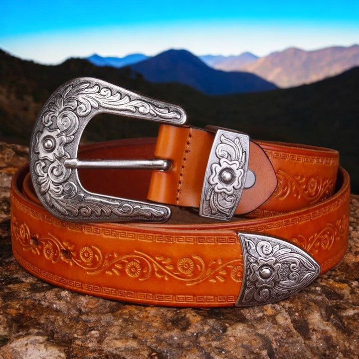 Caramel cowboy style men's belt with a large engraved metal buckle & durable leather finish.