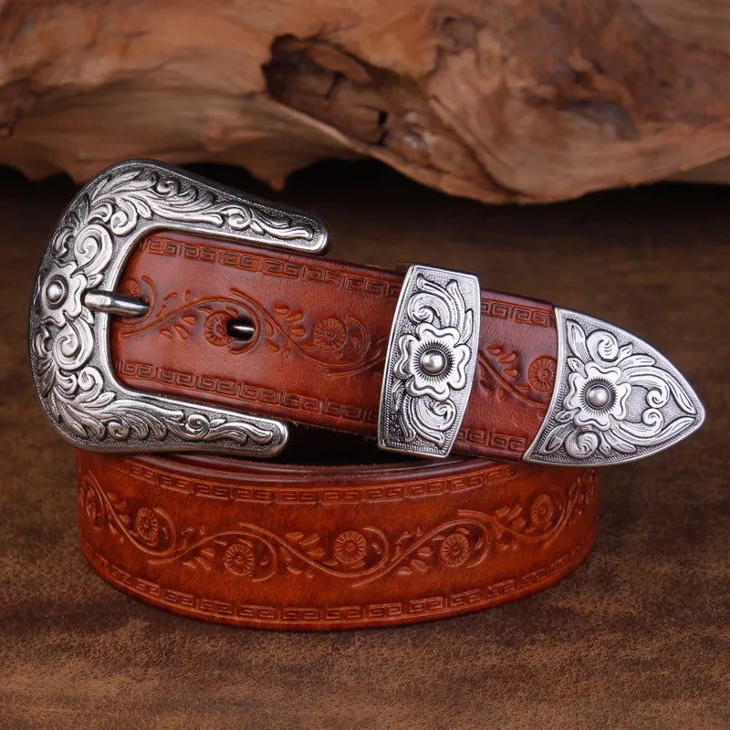 Men's coffee leather western belt, embossed with a scroll design, featuring a decorative engraved metal buckle.