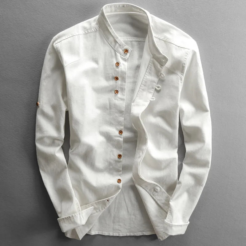 White cotton-linen band collar shirt on a hanger, showcasing its lightweight summer design