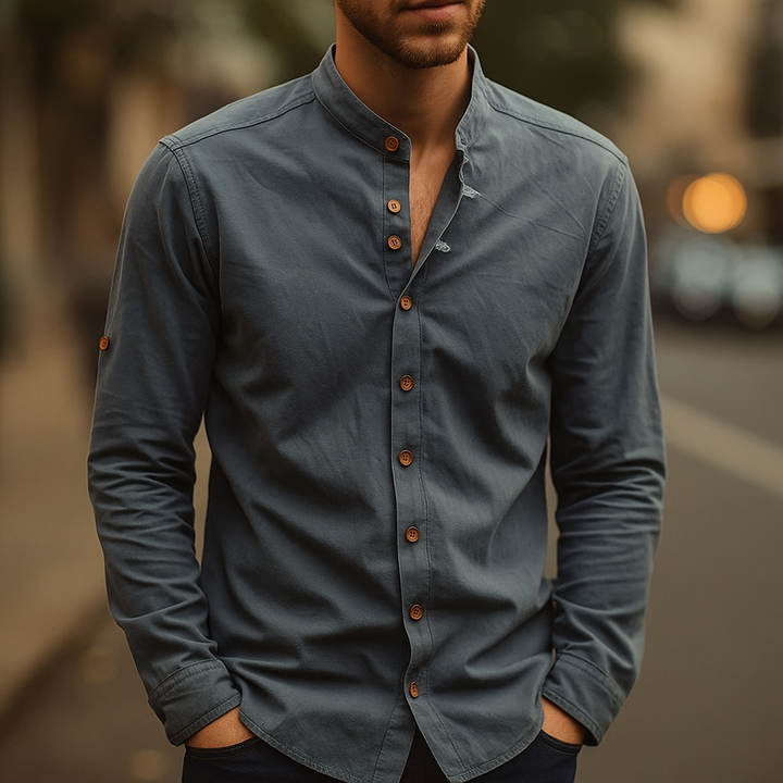Detail shot of the buttons on a men's cotton-linen band collar shirt, minimalist design