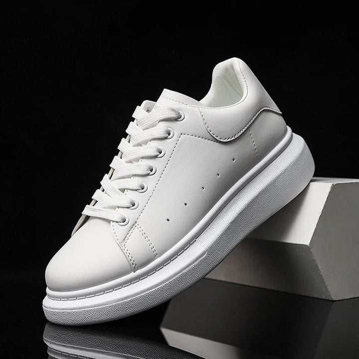 Black men's platform sneakers with lace-up closure. Trendy, comfortable casual shoes for modern everyday style.