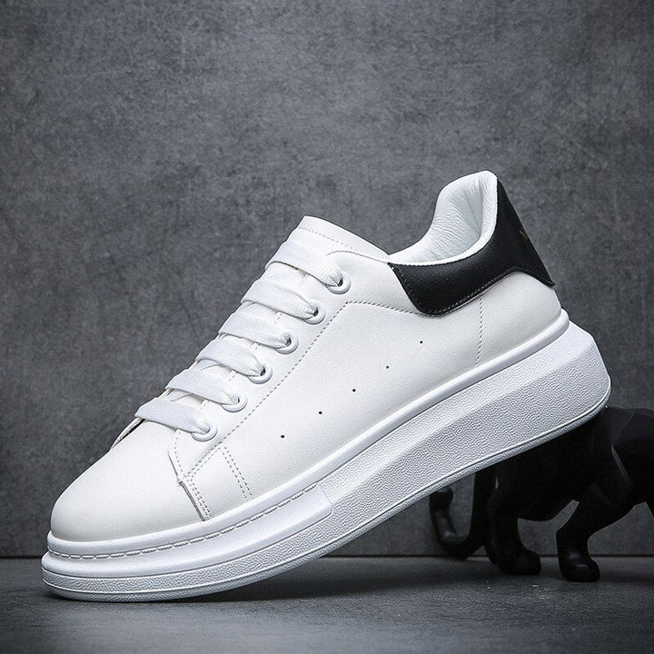 Stylish men's platform sneakers, lace-up design for casual comfort. Perfect minimalist footwear for streetwear outfits.