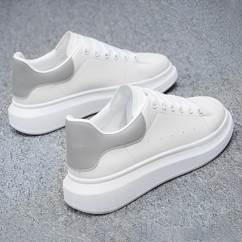 Black lace-up platform sneakers for men. Modern, comfortable casual shoes with a minimalist streetwear aesthetic.