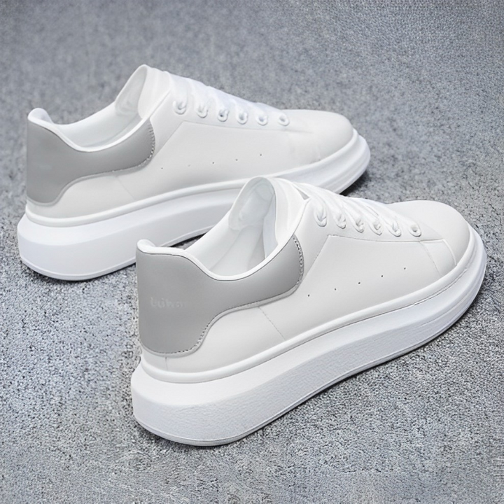 Black lace-up platform sneakers for men. Modern, comfortable casual shoes with a minimalist streetwear aesthetic.