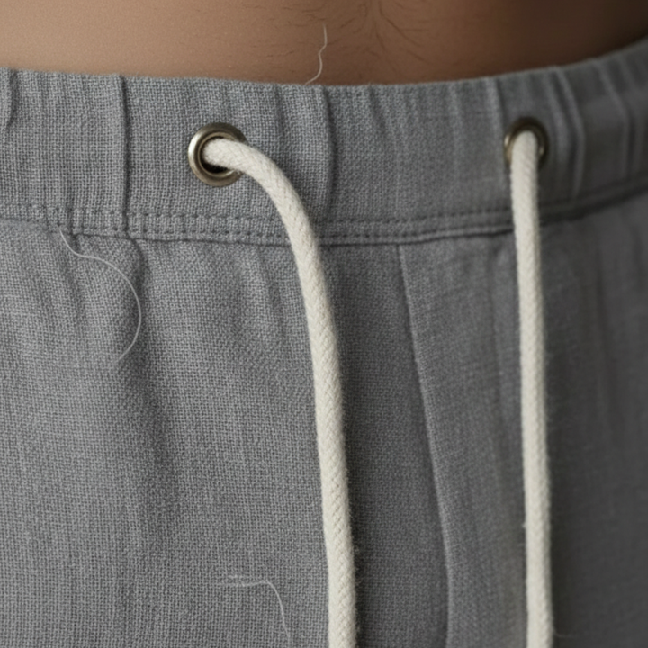 Mens relaxed fit linen trousers with adjustable drawstring waist. Lightweight & stylish.