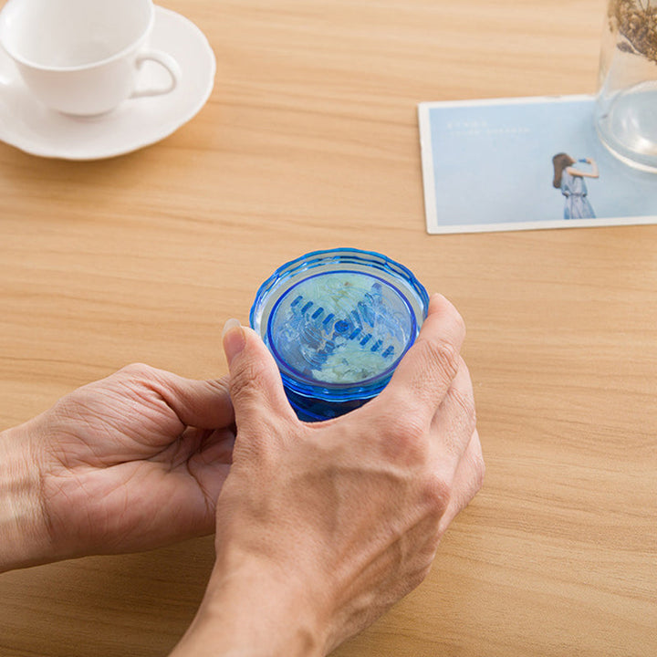 Handheld garlic mincer tool with comfortable grip, ideal for quick and efficient cooking