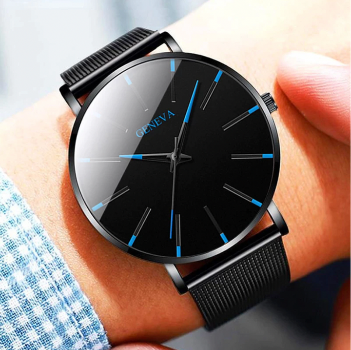 Minimalist men's sustainable watch with a black face & vegan leather strap, perfect for timeless style.